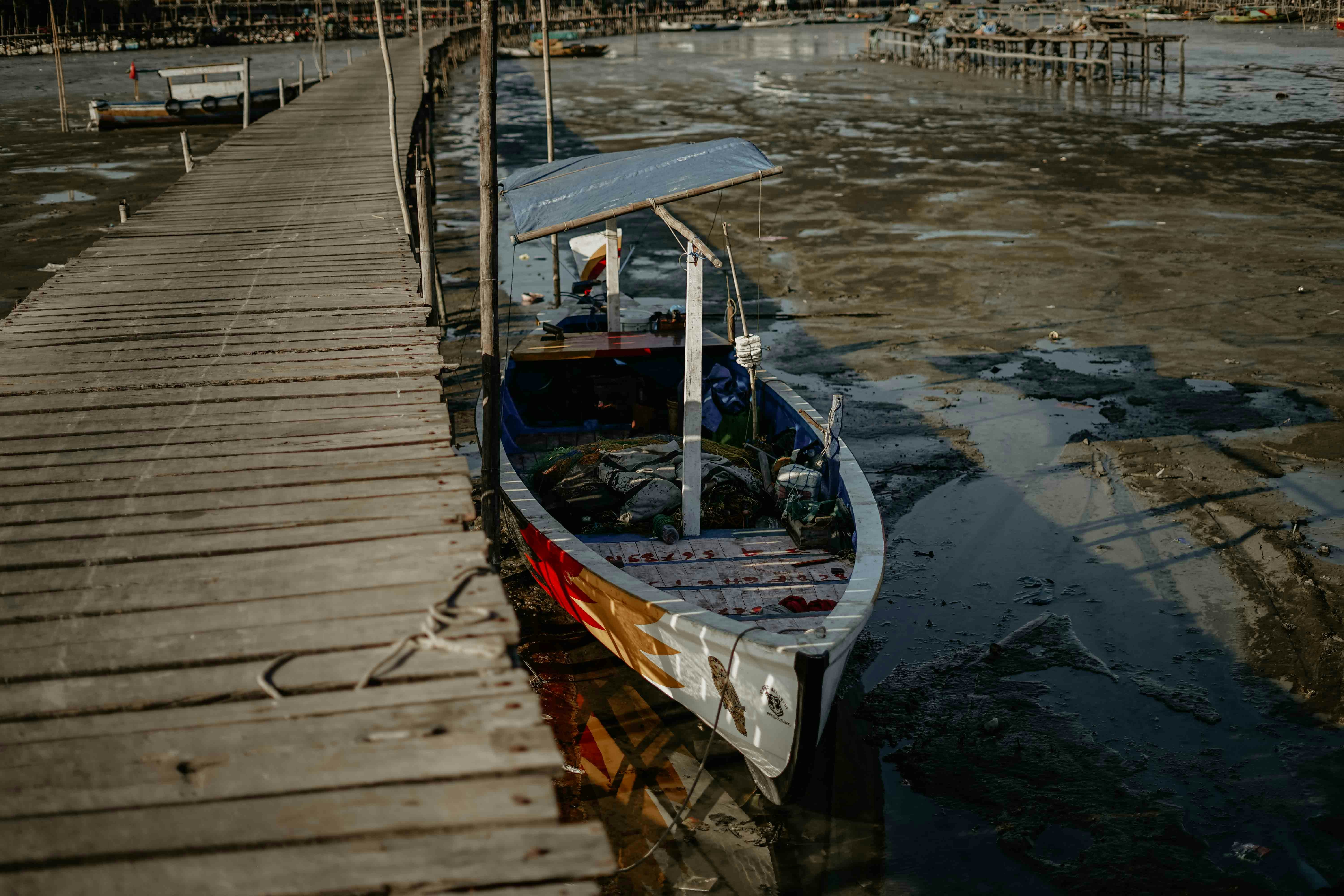 a boat is parked on the side of a dock