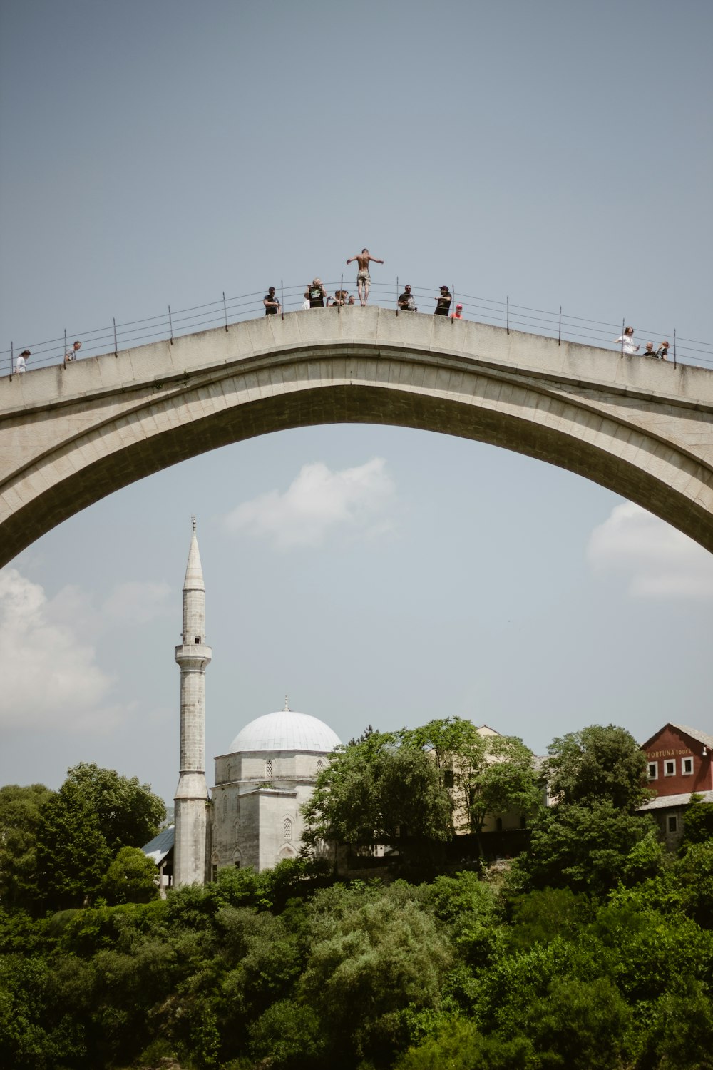 a bridge with people walking on it