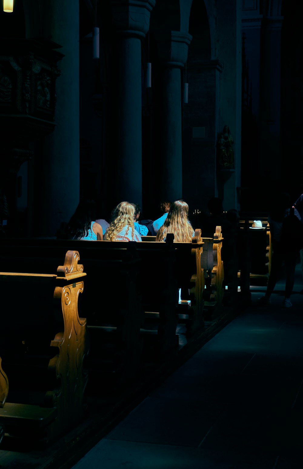 a couple of people sitting at a piano