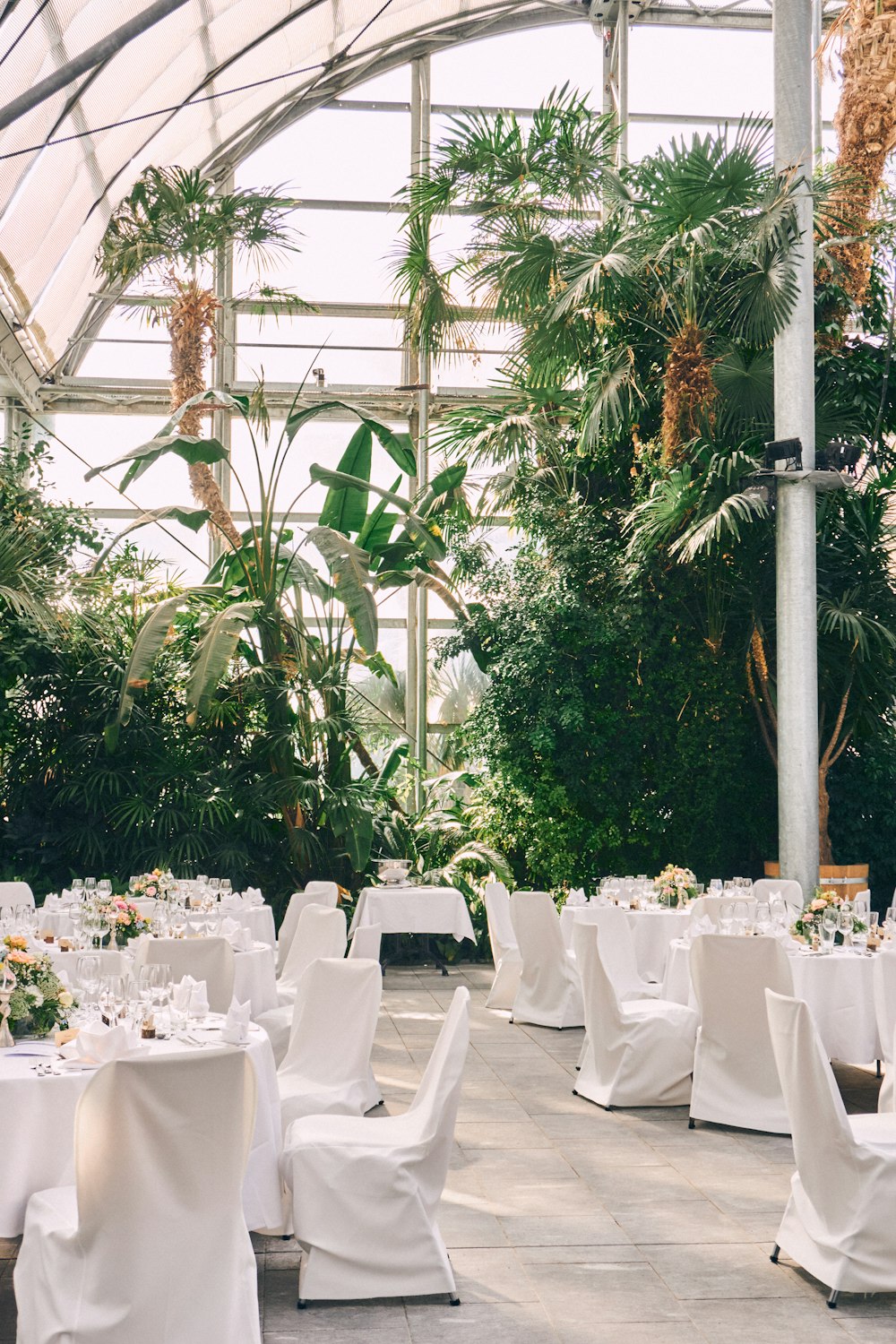 a large outdoor tent with tables and chairs