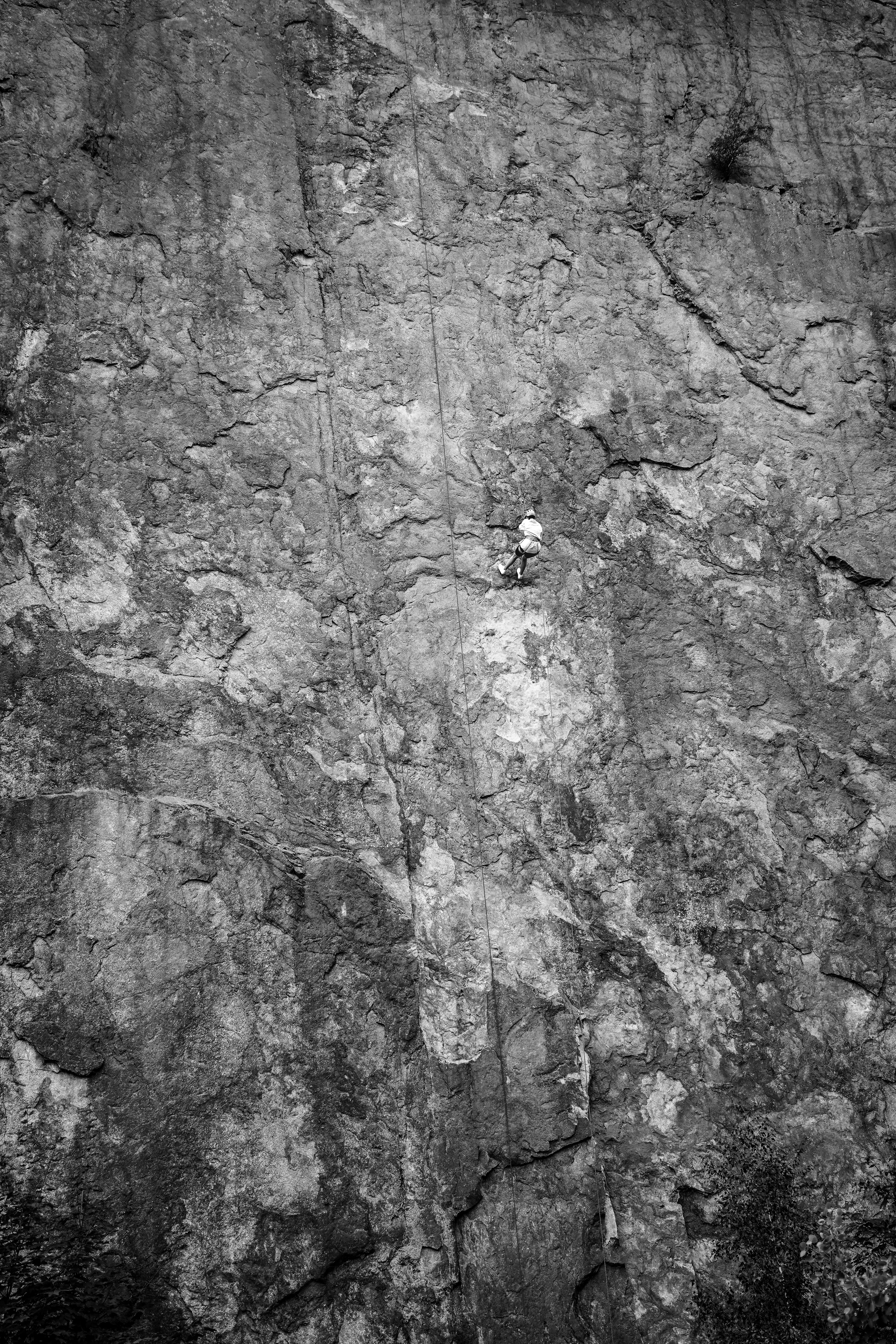 a person climbing a rock