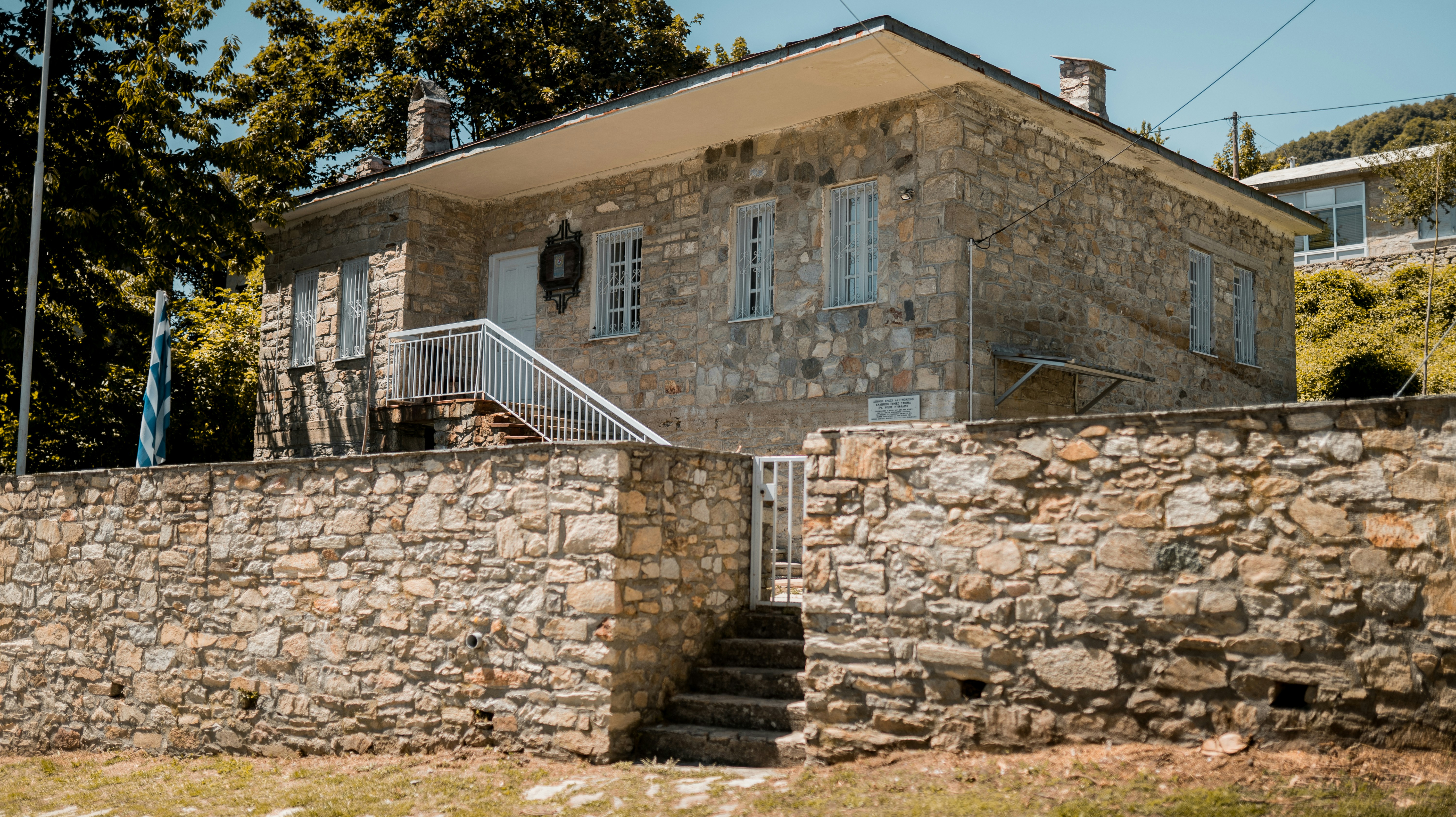 a stone building with a stone wall