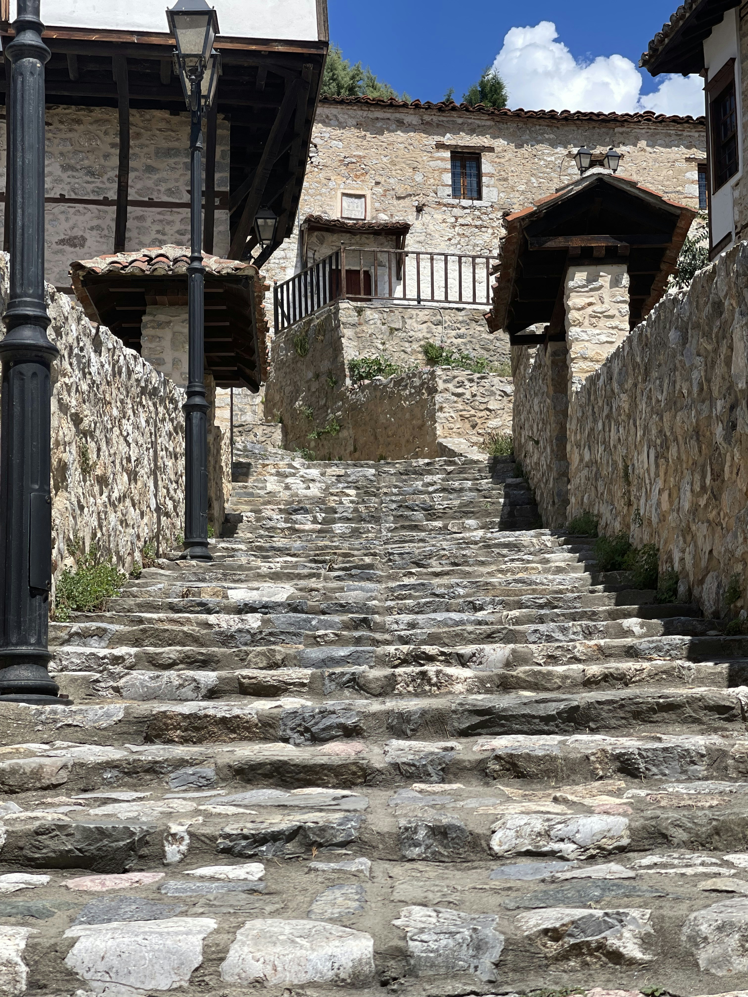 a stone staircase leading up to a stone building