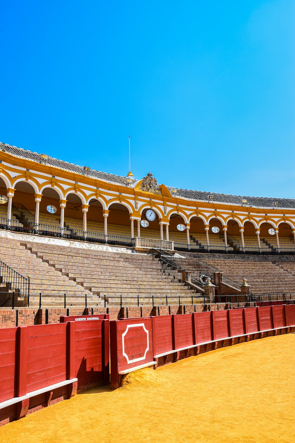 a stadium with red seats