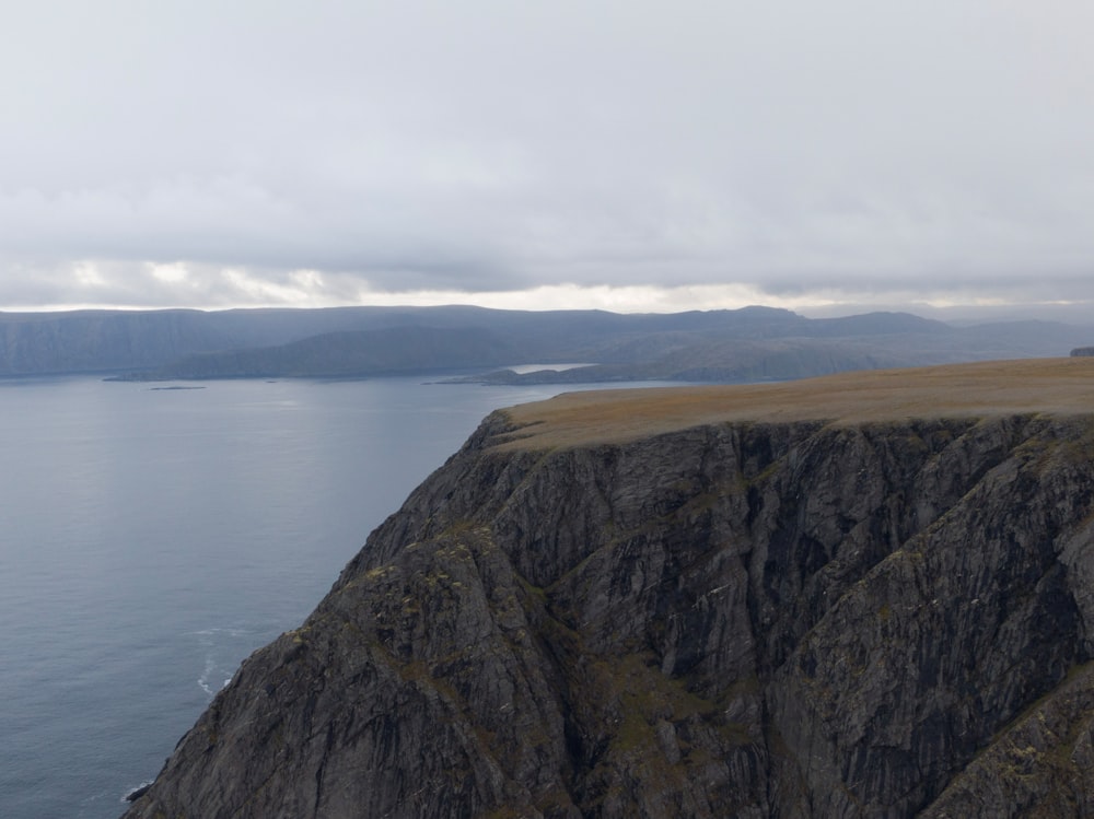 a cliff overlooking a body of water