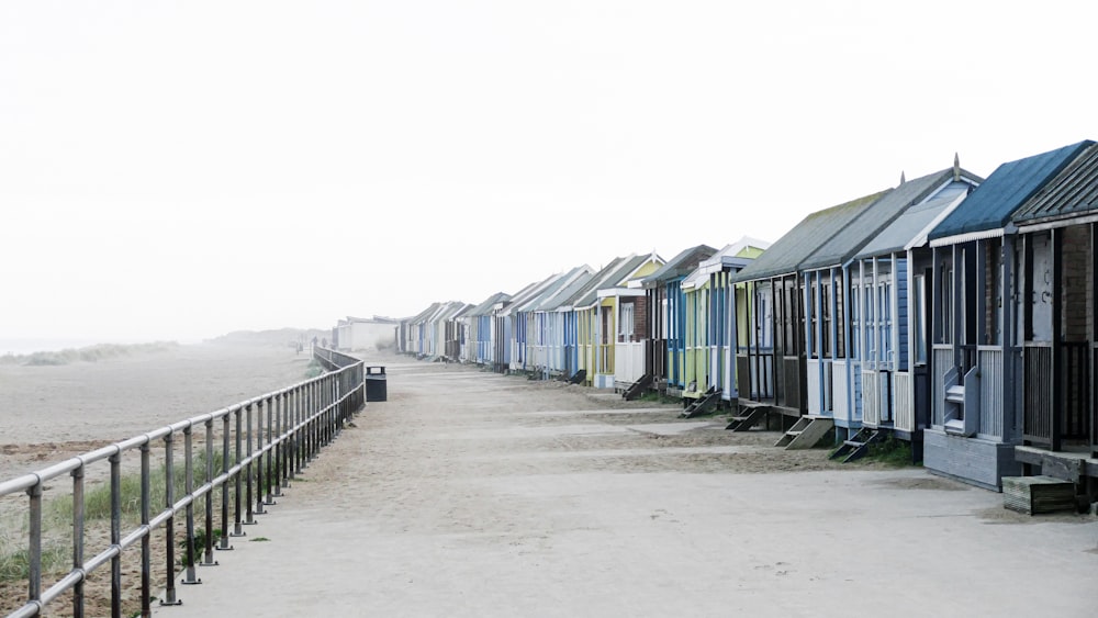 a row of houses on a beach