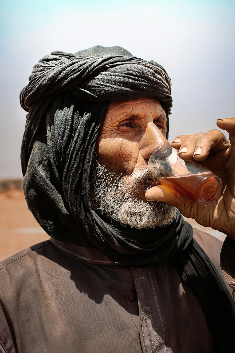 a man drinking from a bottle