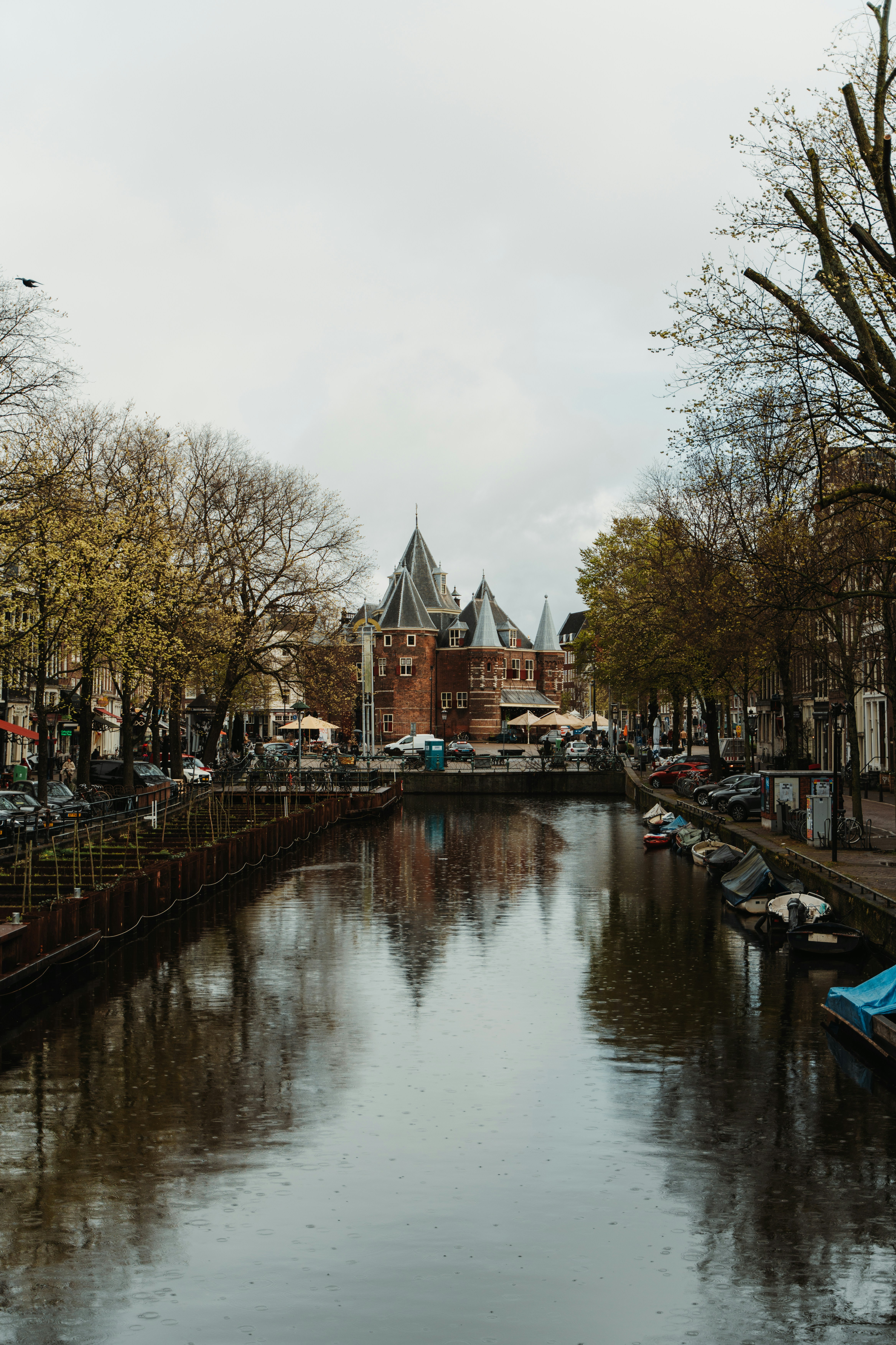 a body of water with a building in the background