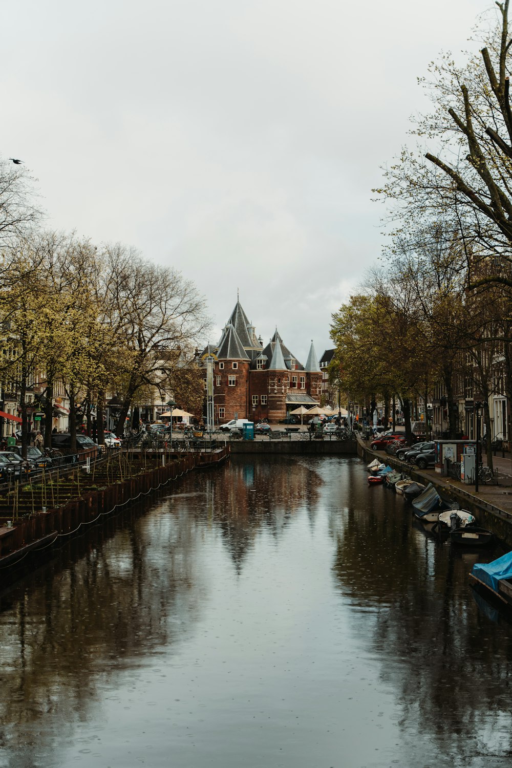 a body of water with a building in the background