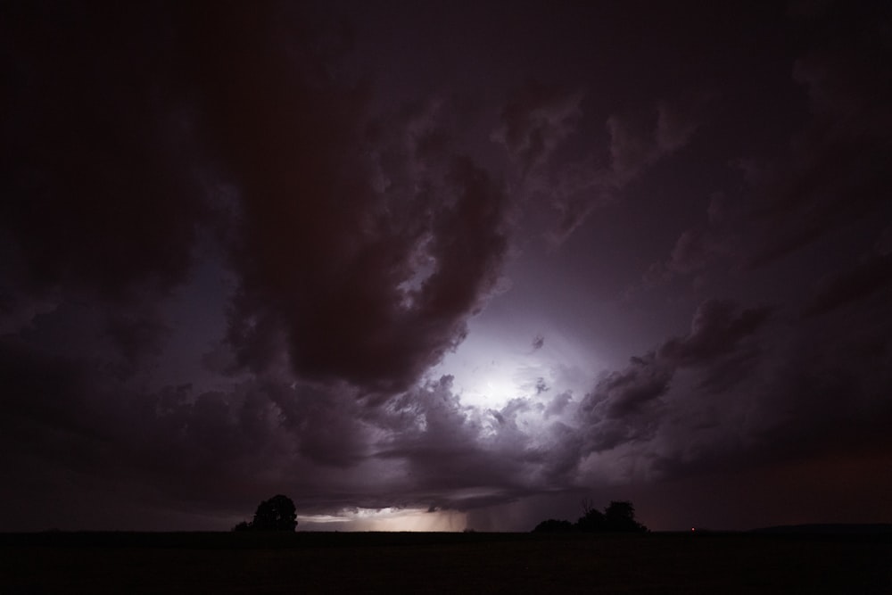 a dark sky with clouds