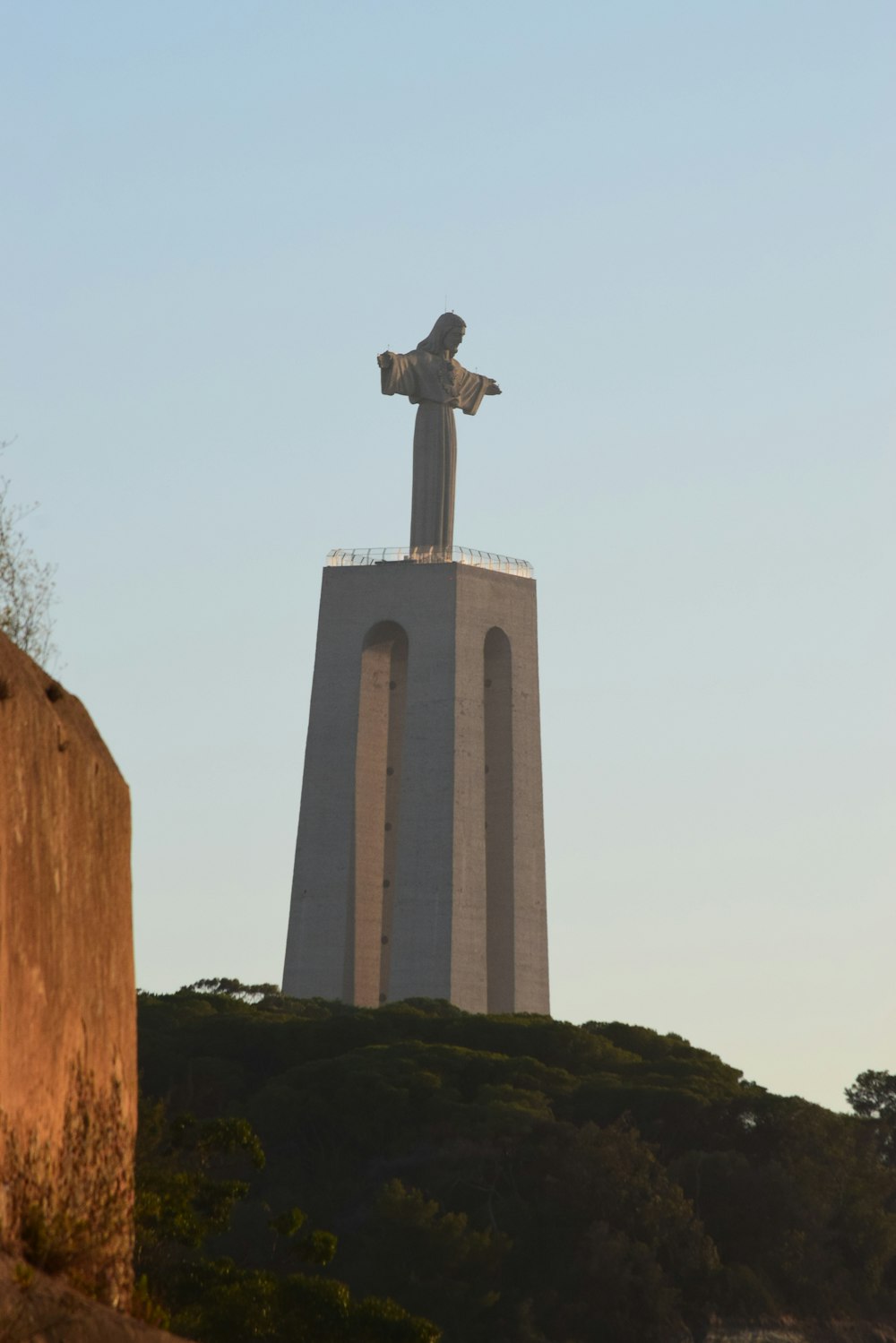 a statue on a tower