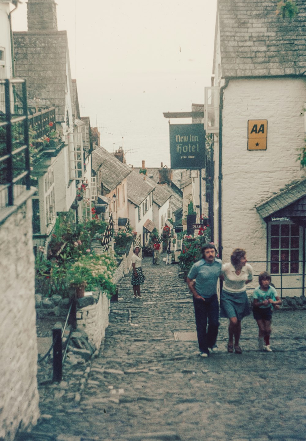 people walking on a stone street