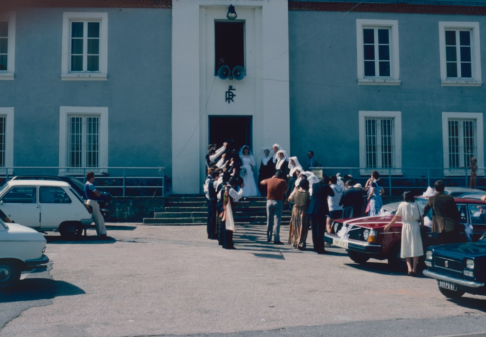 a group of people standing on steps outside a building