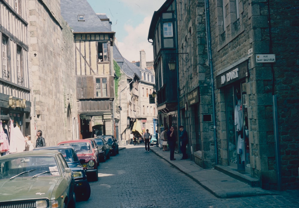 a street with cars and people