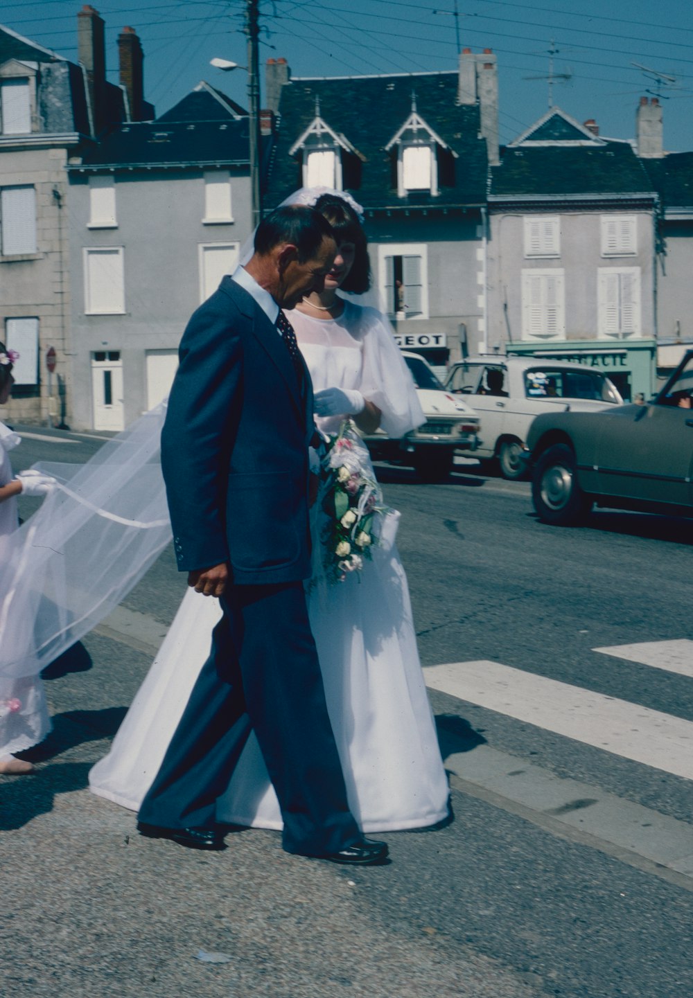 a man and woman in wedding attire