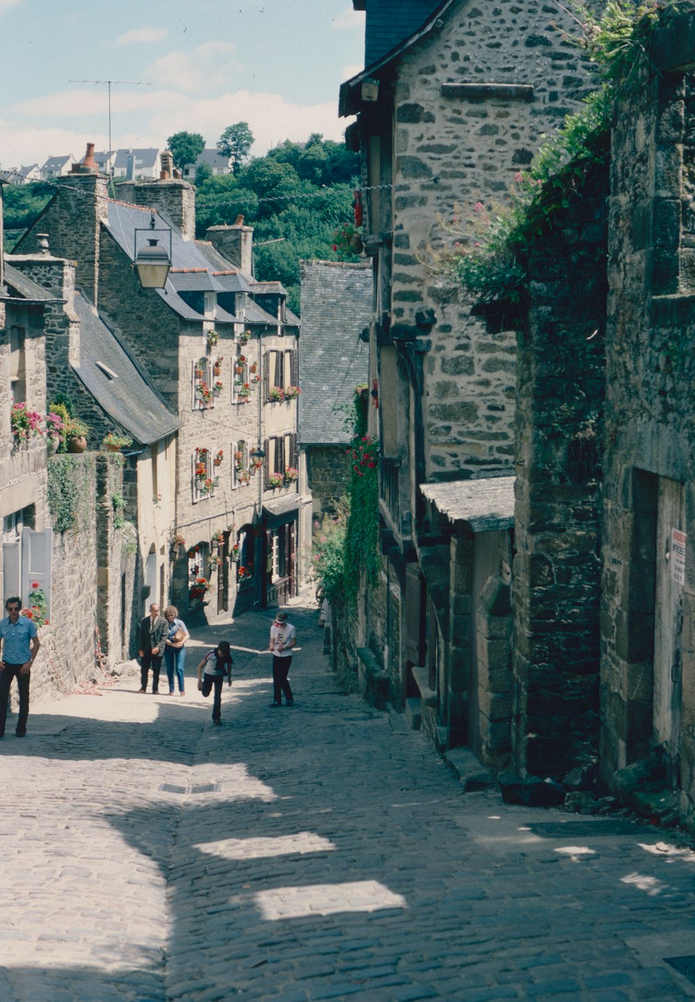 people walking on a stone street