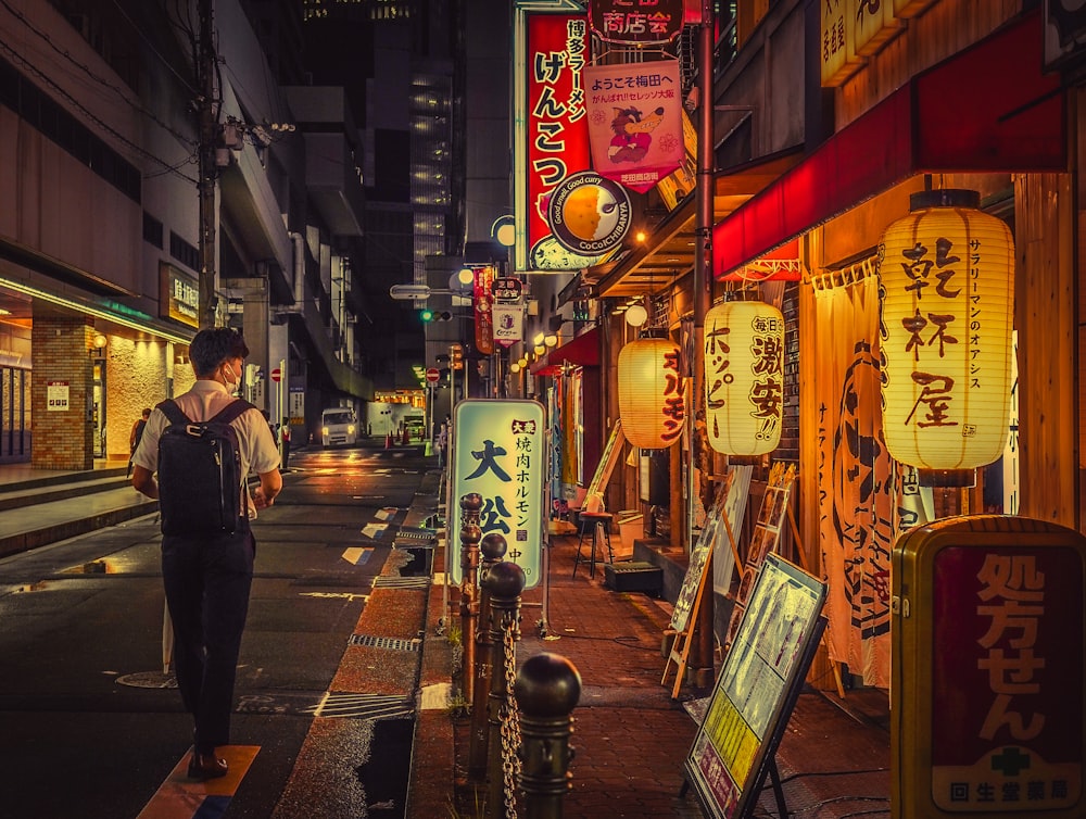 a person standing on a sidewalk