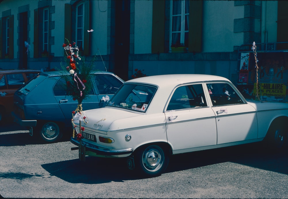 a white car with a christmas tree on top of it