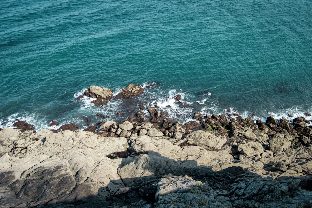 a rocky beach with waves crashing