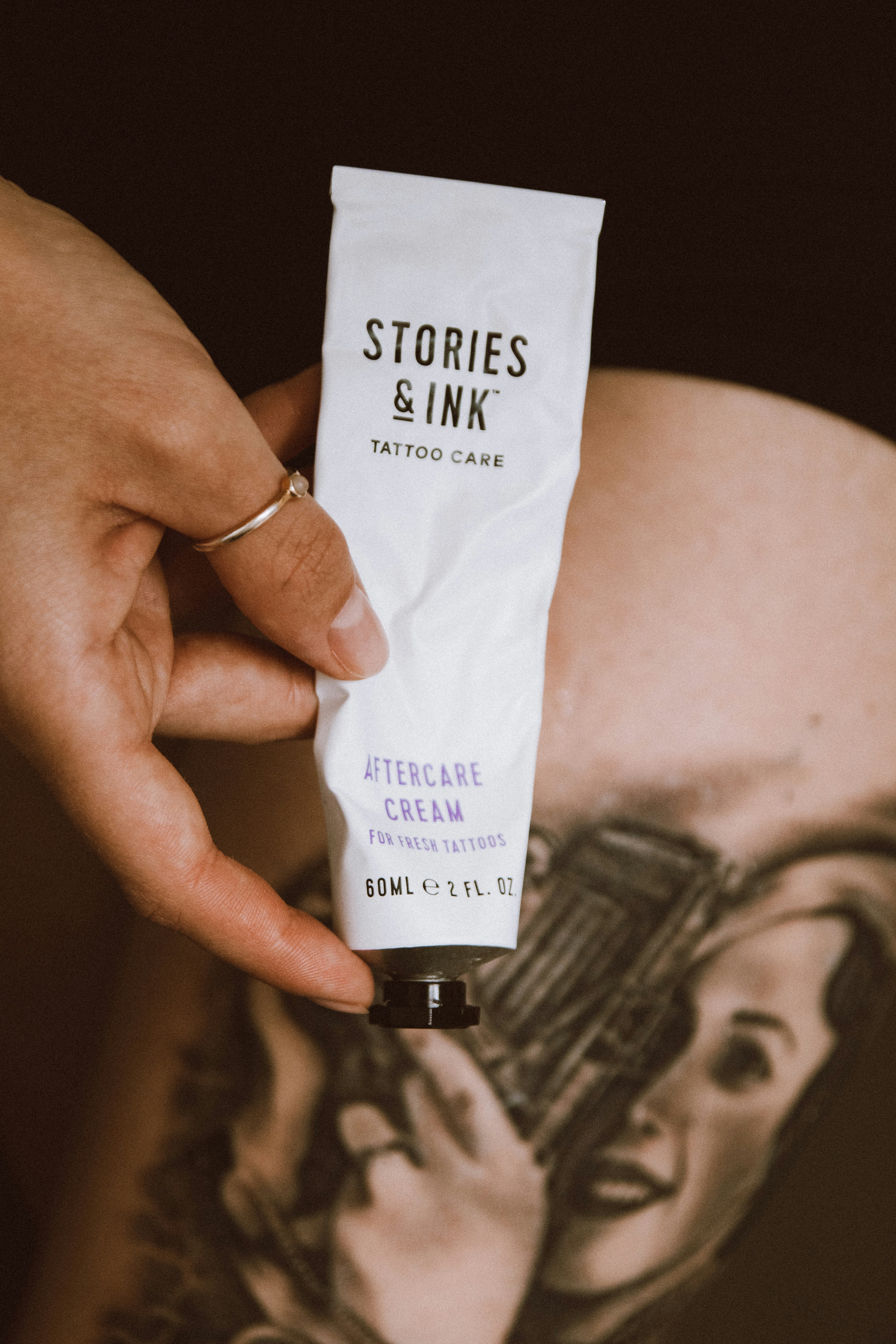 a person holding a white tube