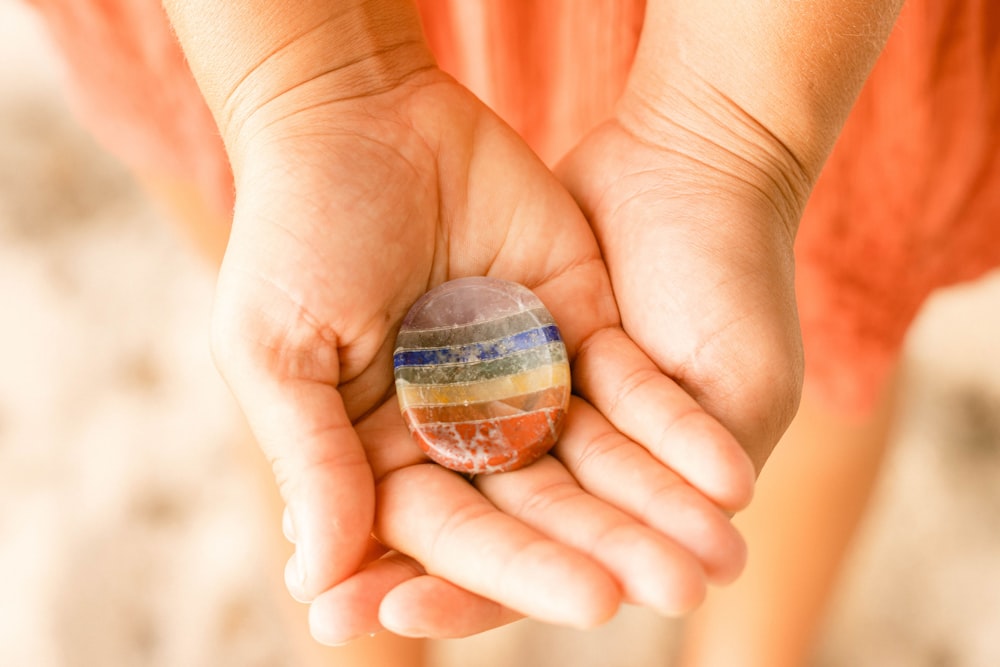 a person holding a small rock