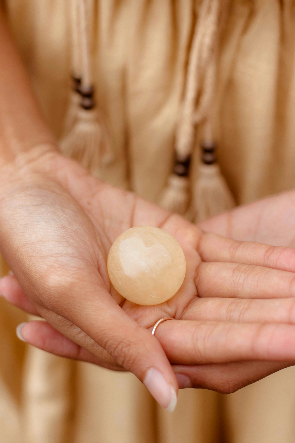 a person holding a white egg