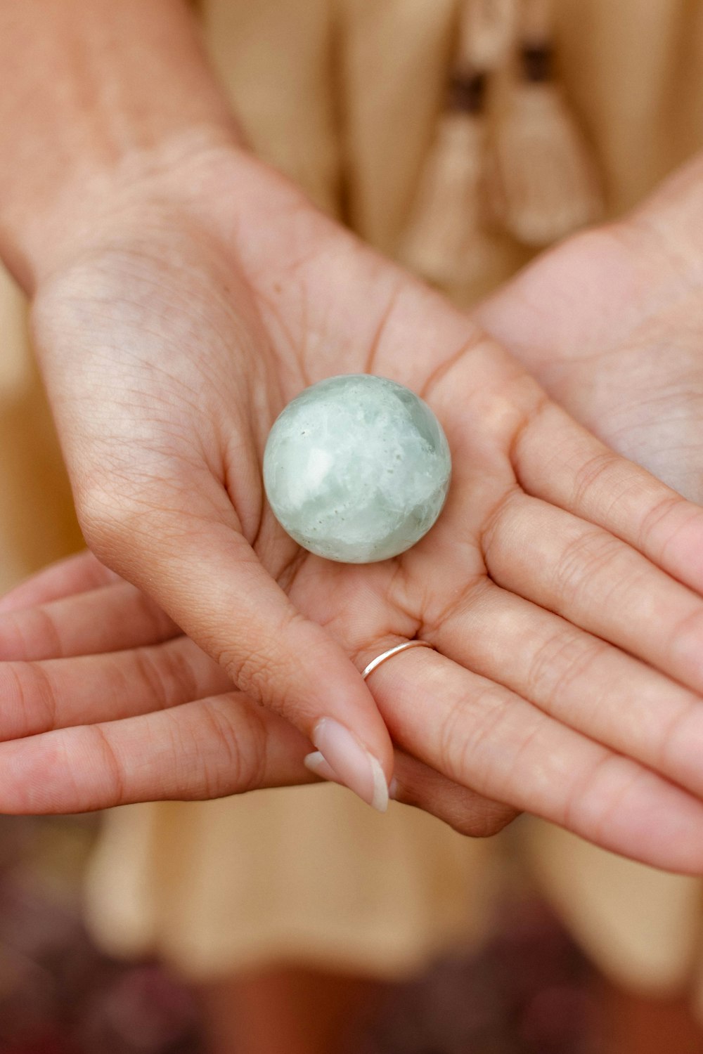 a hand holding a rock