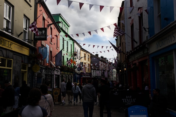 A lively street scene in Saint Barth with the Barth's Brothers banner hanging overhead.