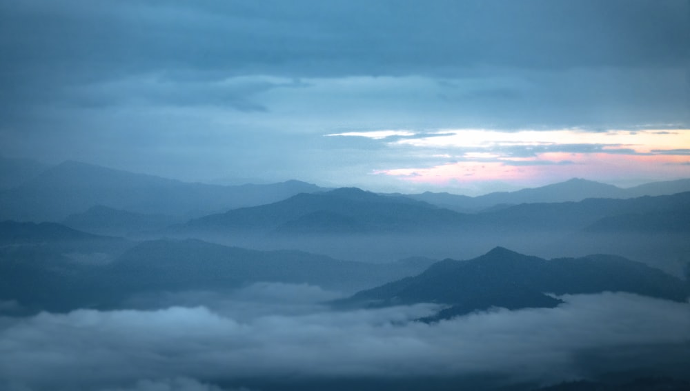 a view of the mountains and clouds