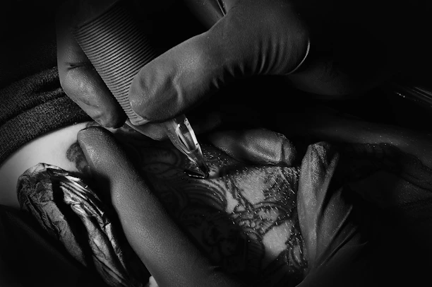 a close-up of a person holding a needle