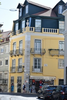 a yellow building with a flag on top