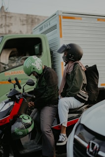 a couple of men on a motorcycle