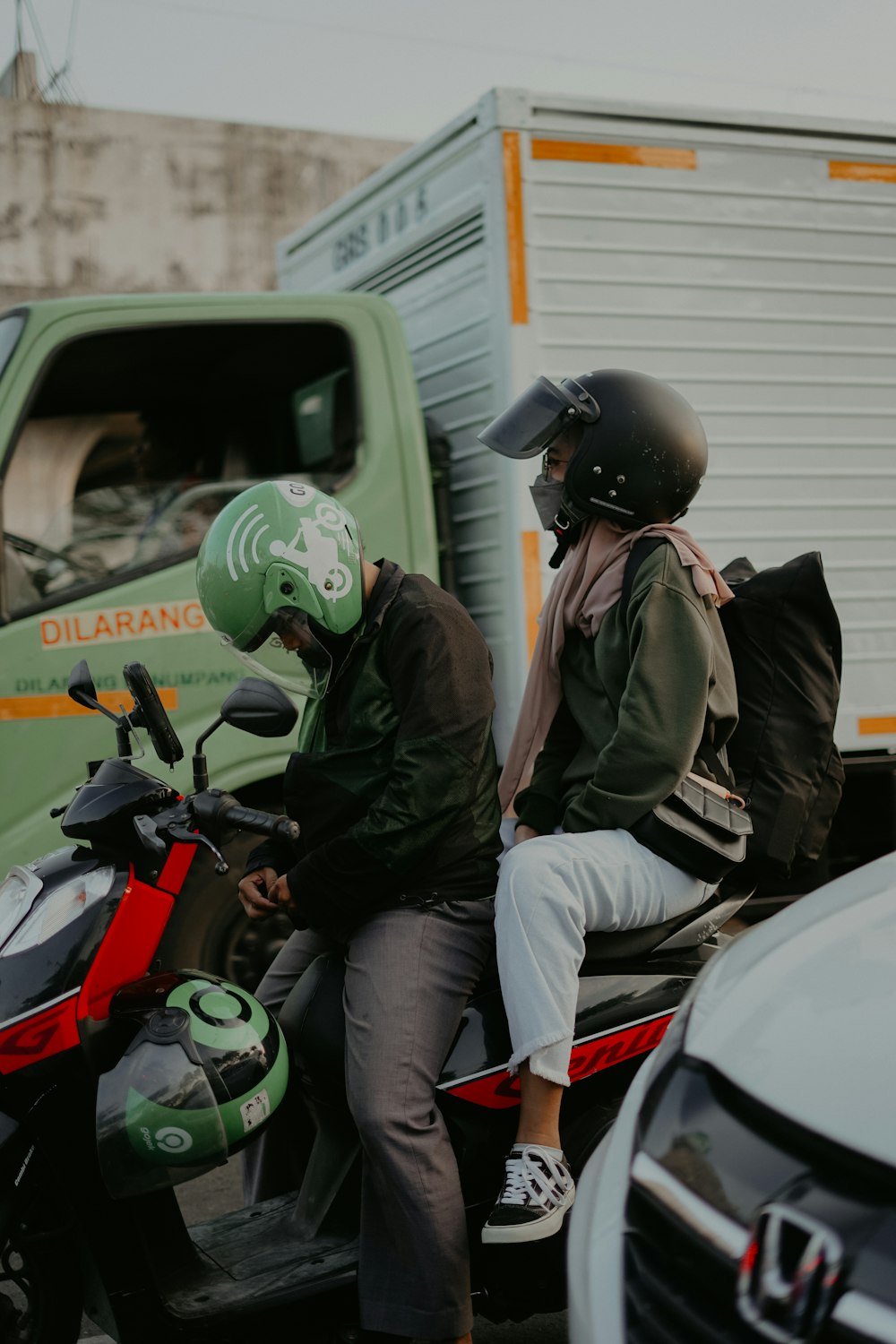 a couple of men on a motorcycle