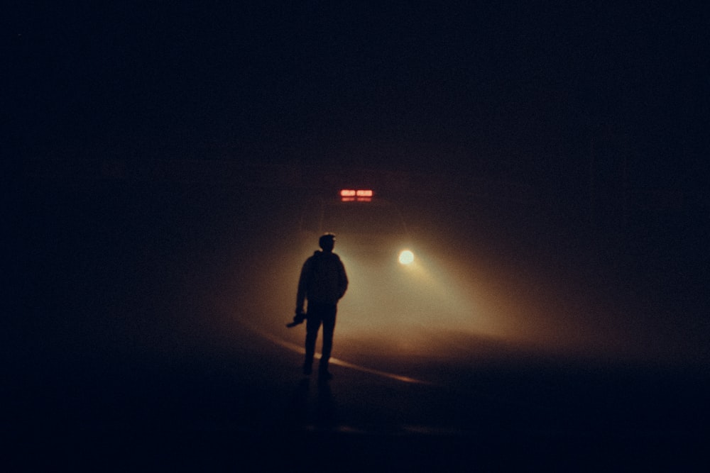 a person standing in the dark