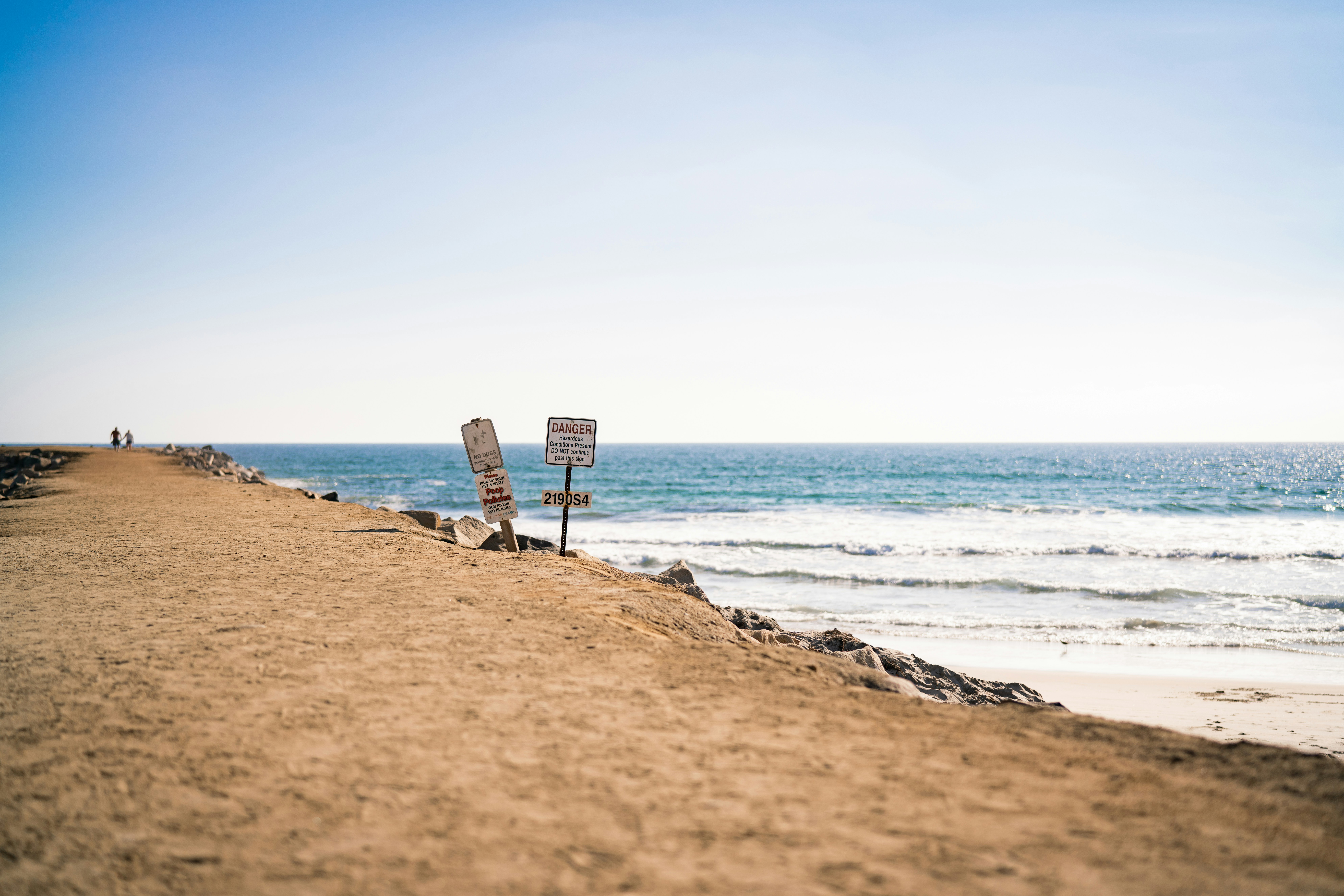 a beach with signs
