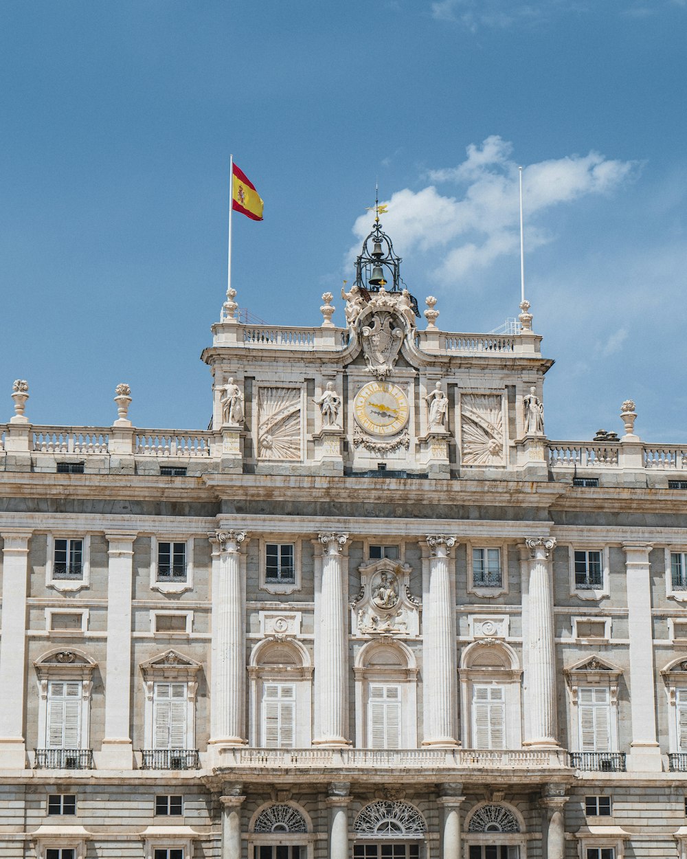 a large building with a flag on top