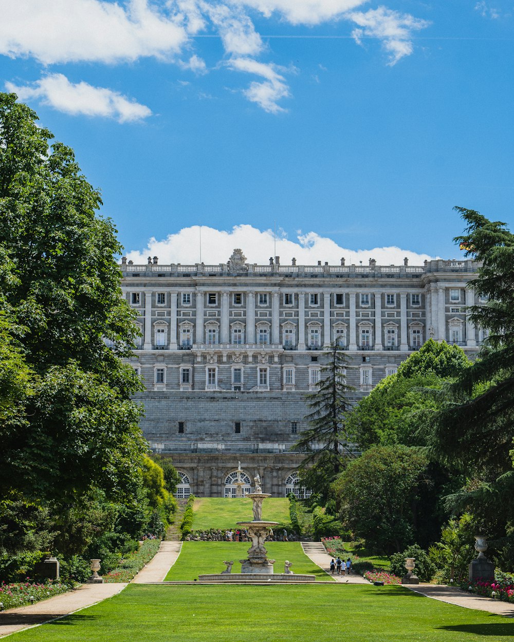 a large building with trees in front of it