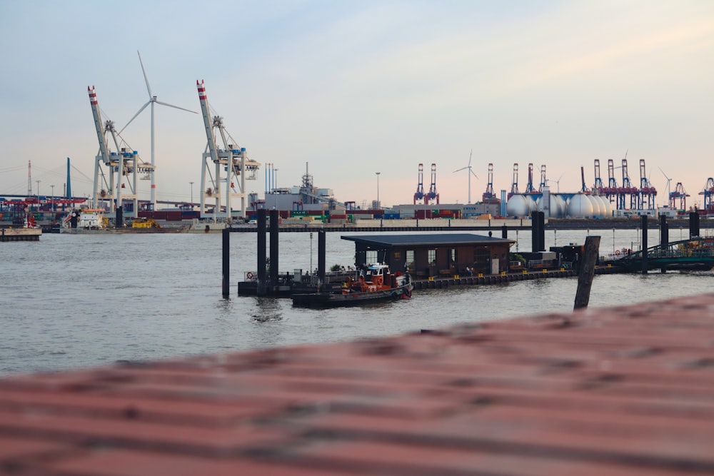 a dock with a building and cranes