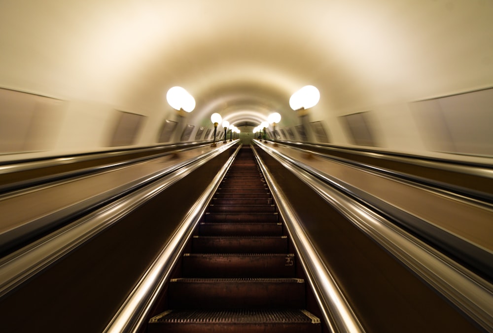 a long escalator in a tunnel