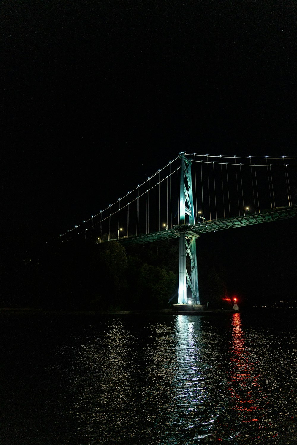 a bridge with lights at night