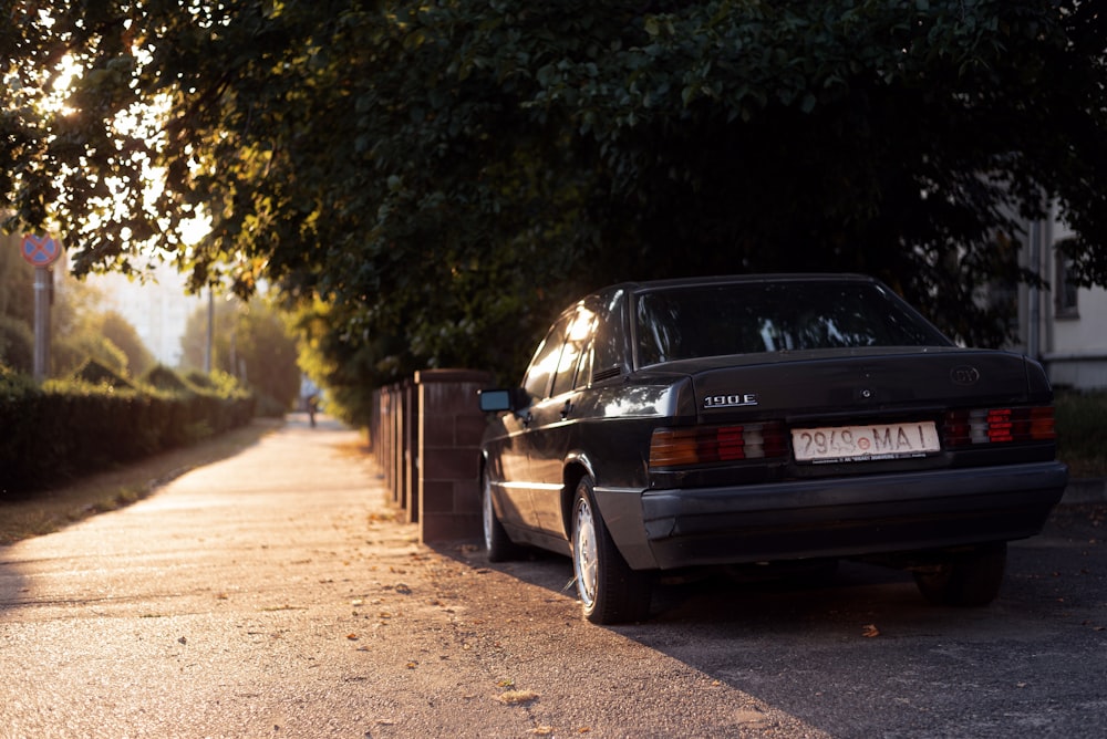 a black car parked on a road