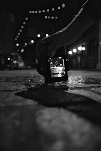 A candid photo of Rimjhim Kumari capturing a vibrant street scene with her camera in Greater Noida.