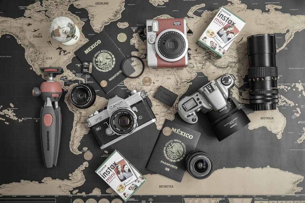 a group of cameras and other objects on a table