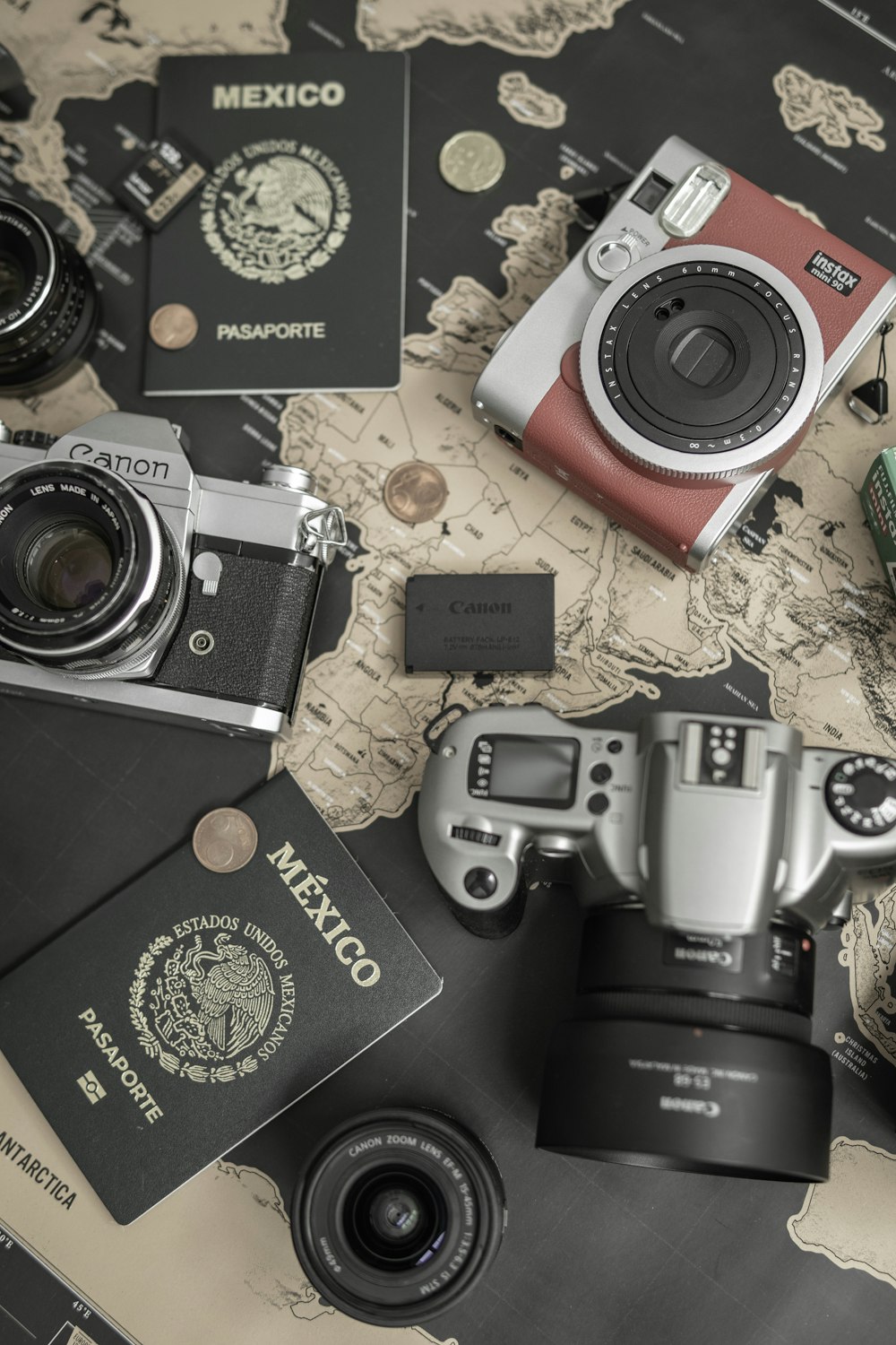 a collection of cameras and coins