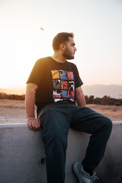 a man sitting on a ledge
