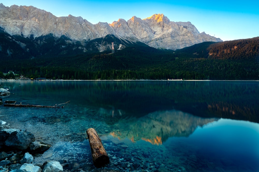 a lake with mountains in the background