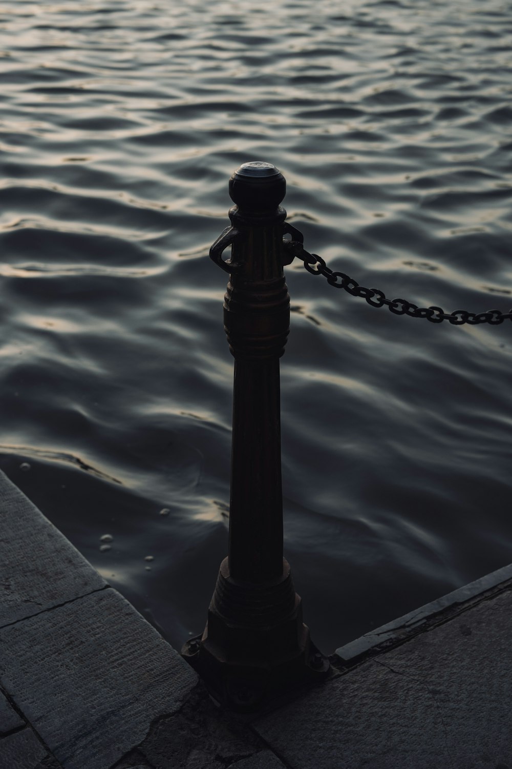 a black pole on a dock