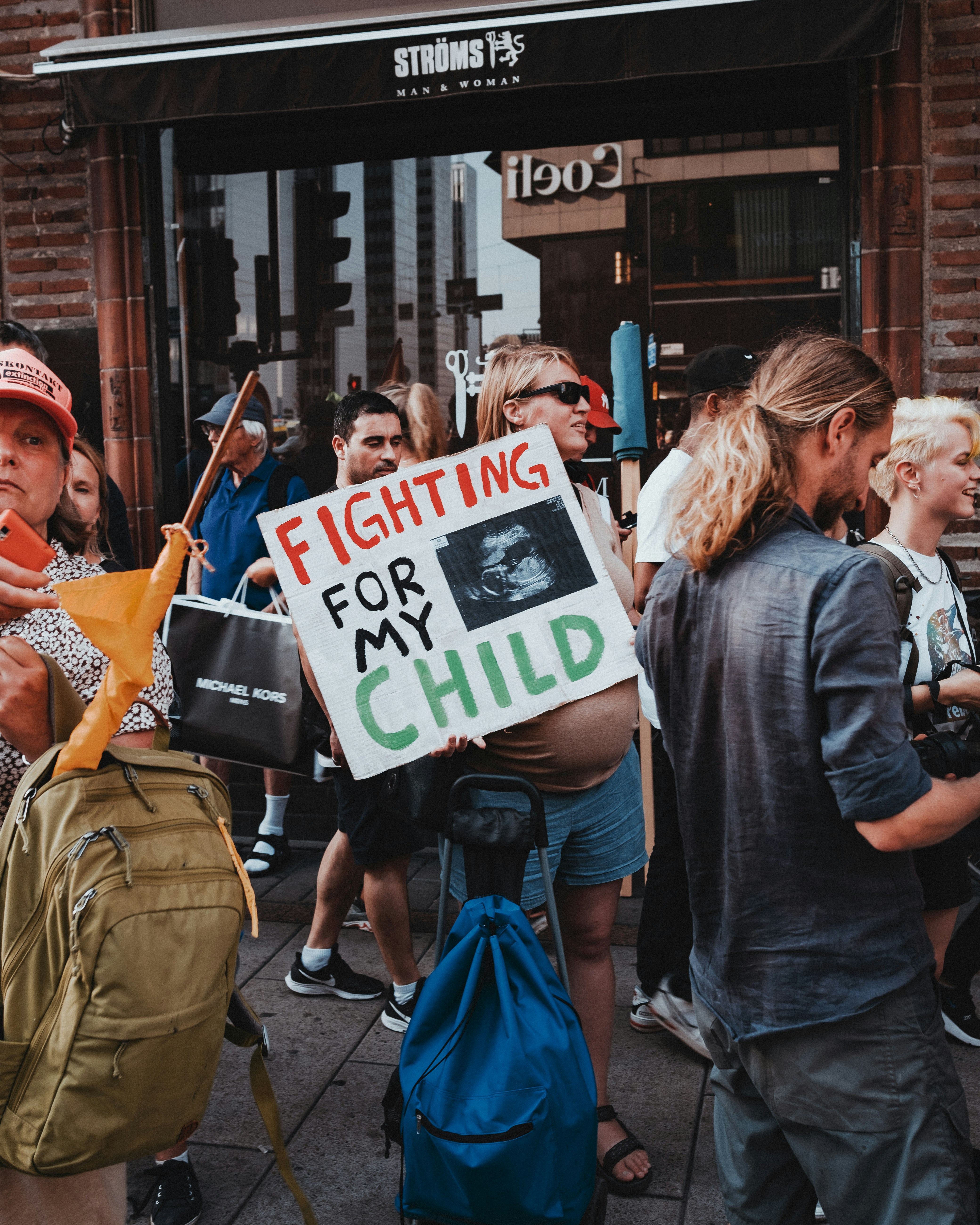 a group of people holding signs