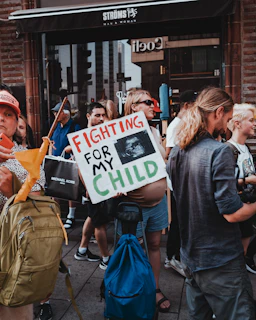 a group of people holding signs