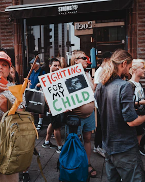 a group of people holding signs
